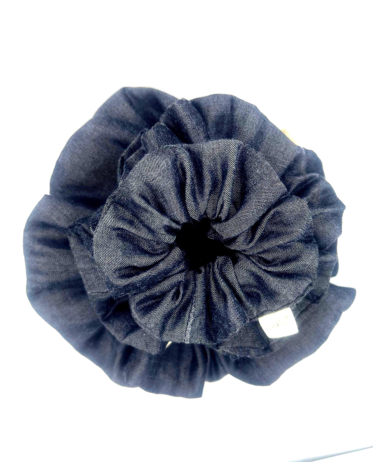 Blue Denim scrunchie on a white background