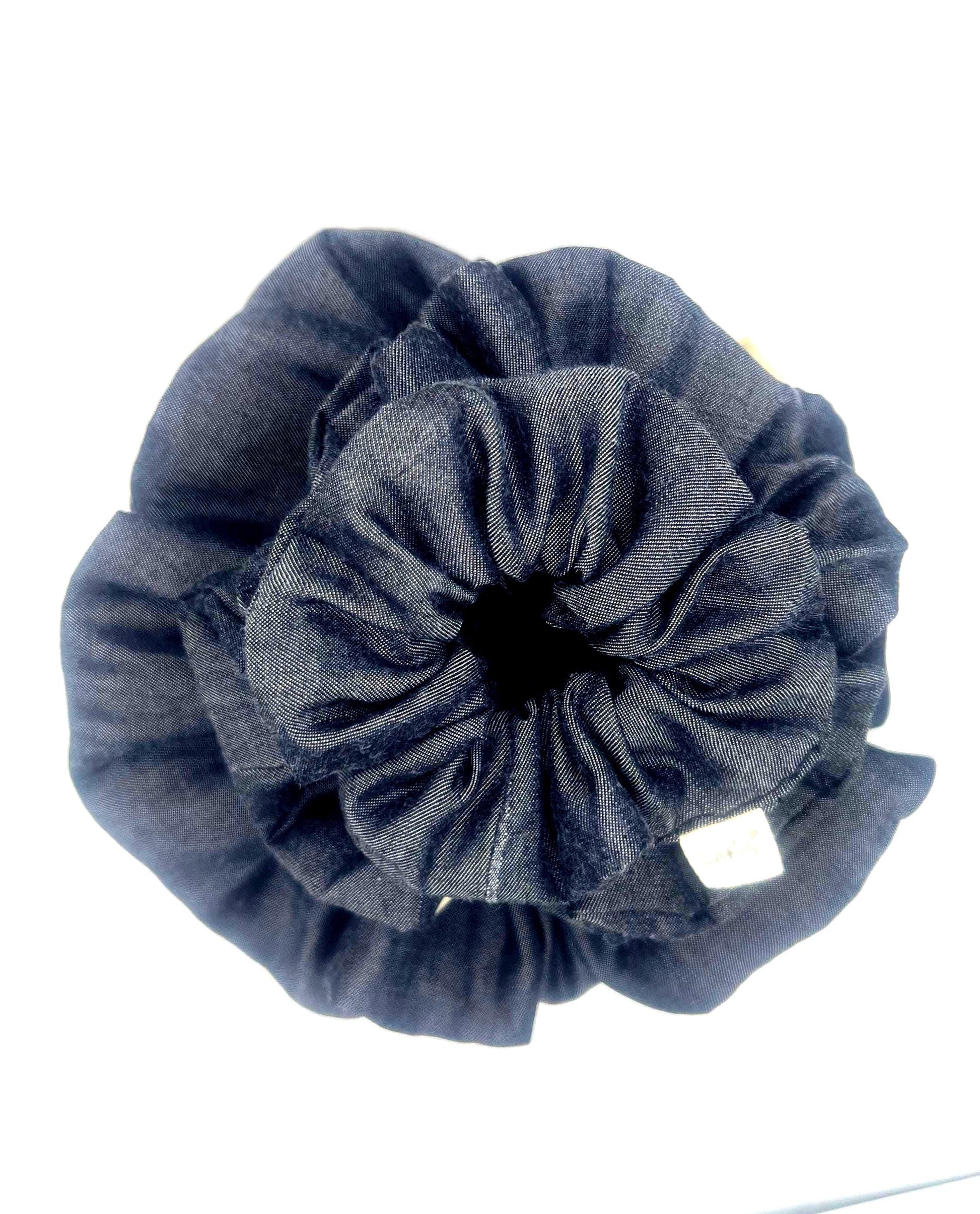 Blue Denim scrunchie on a white background